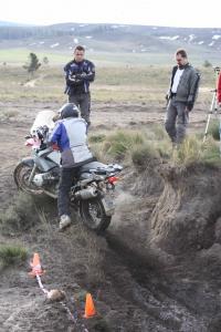 Spinnining the back wheel after the tricky water crossing in thick sand